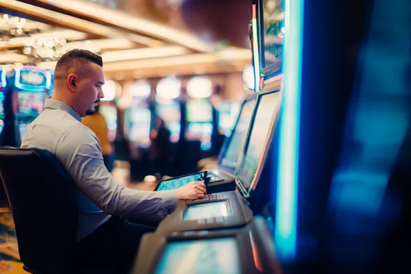 9777BET App — Enjoy seamless gaming on your smartphone A young woman relaxing with her phone while dynamic casino elements float around her, illustrating the smooth mobile experience offered by the 9777BET app.