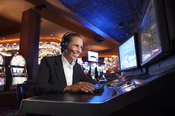 9777BET App — Fast, responsive, and optimized for all devices A cheerful woman in traditional clothing using her smartphone during a festive moment, showing how easily the 9777BET app fits into everyday life.