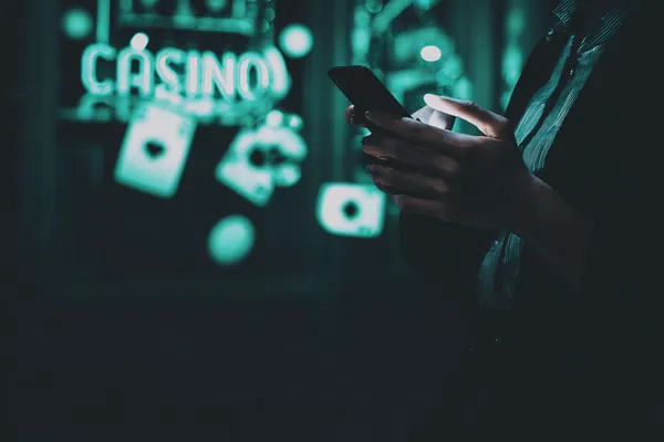 9777BET Casino Games — Enjoy nonstop entertainment A close-up shot of golden coins falling around a spinning roulette wheel, representing immersive casino action at 9777BET.