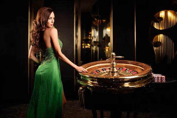 9777BET Member Login — Return to your personalized dashboard A person using their device against a moody casino-themed background, illustrating the smooth re-entry process at 9777BET.